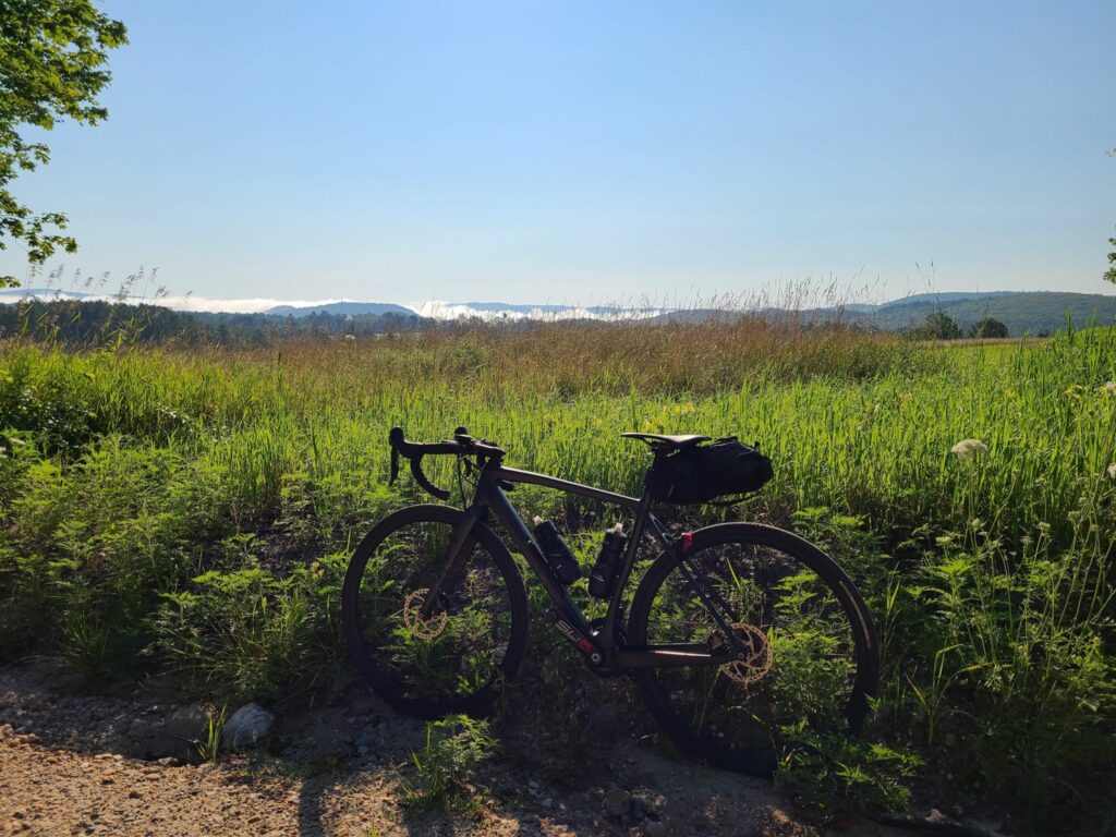 Race Track Rd (gravel) with mist rising in the morning air.